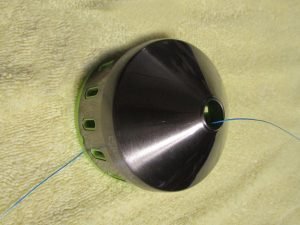 Don't forget you need your line to feed through the cover when spooling a spincast reel