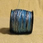 The line feeding over the spool of line will typically help reduce line twist.