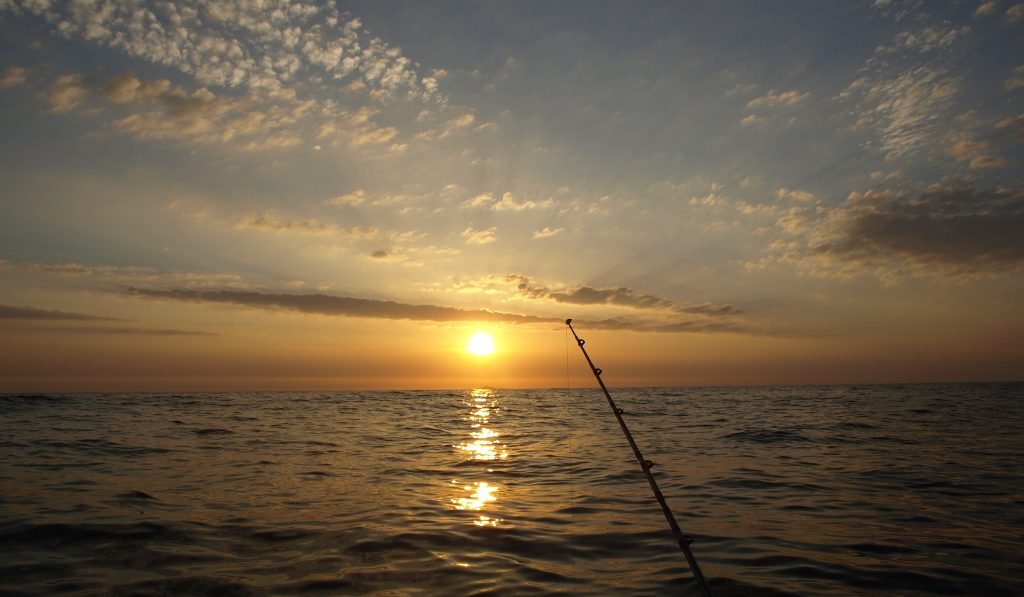 Enjoy the sun setting over the water as you fish at night.