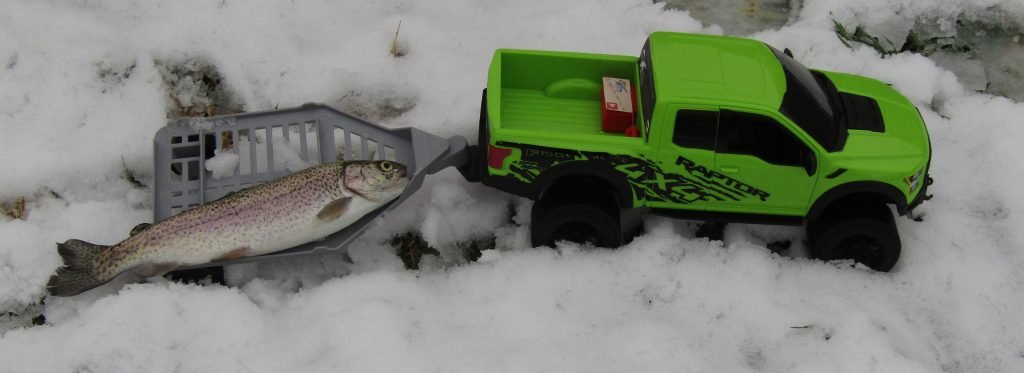 Warm clothes are very necessary when fishing in the snow.