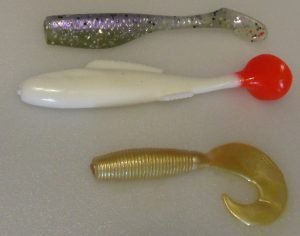 Saltwater plastics often have bright, extravagant colors, but will have a stiffer feel in the hand.